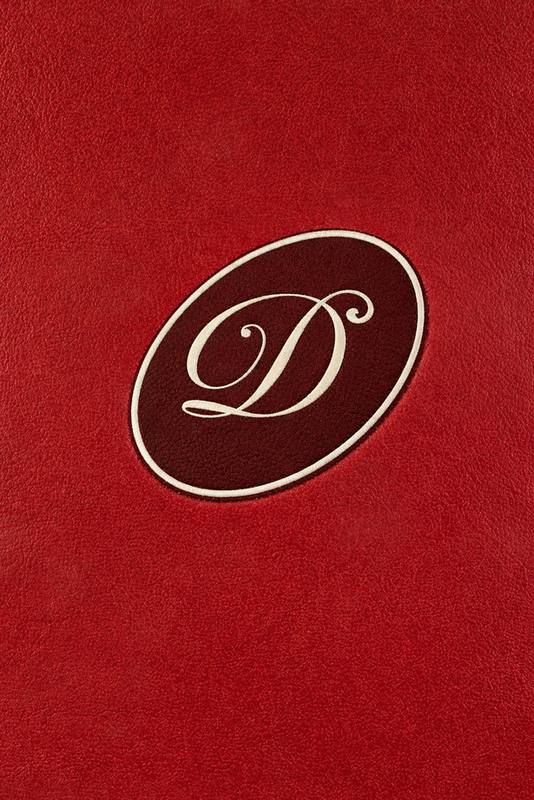 Debut emblem debossed into red velvet